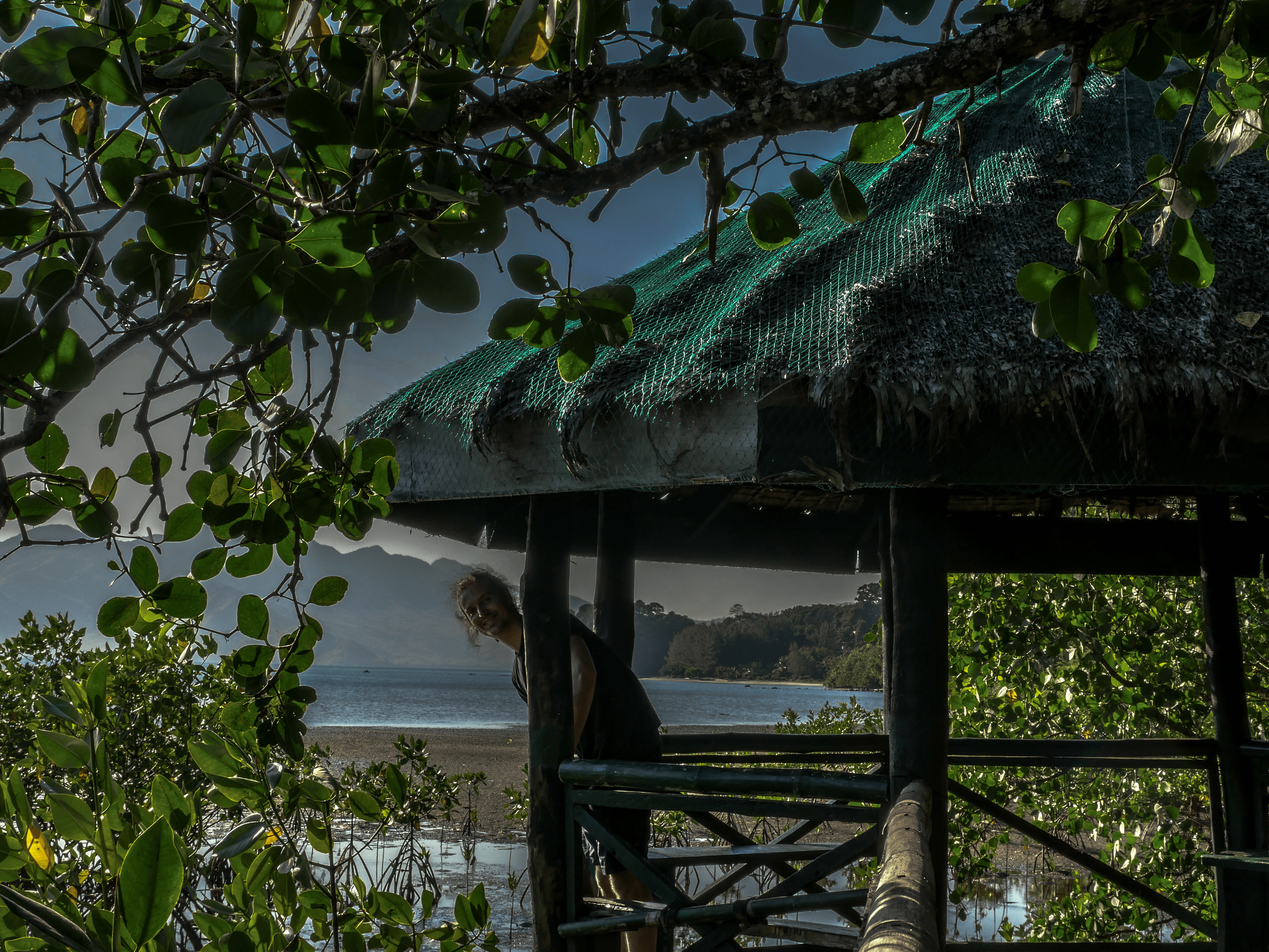 lenny through paradise smiling in little hut in triboa bay mangrove park in subic zambales philippines